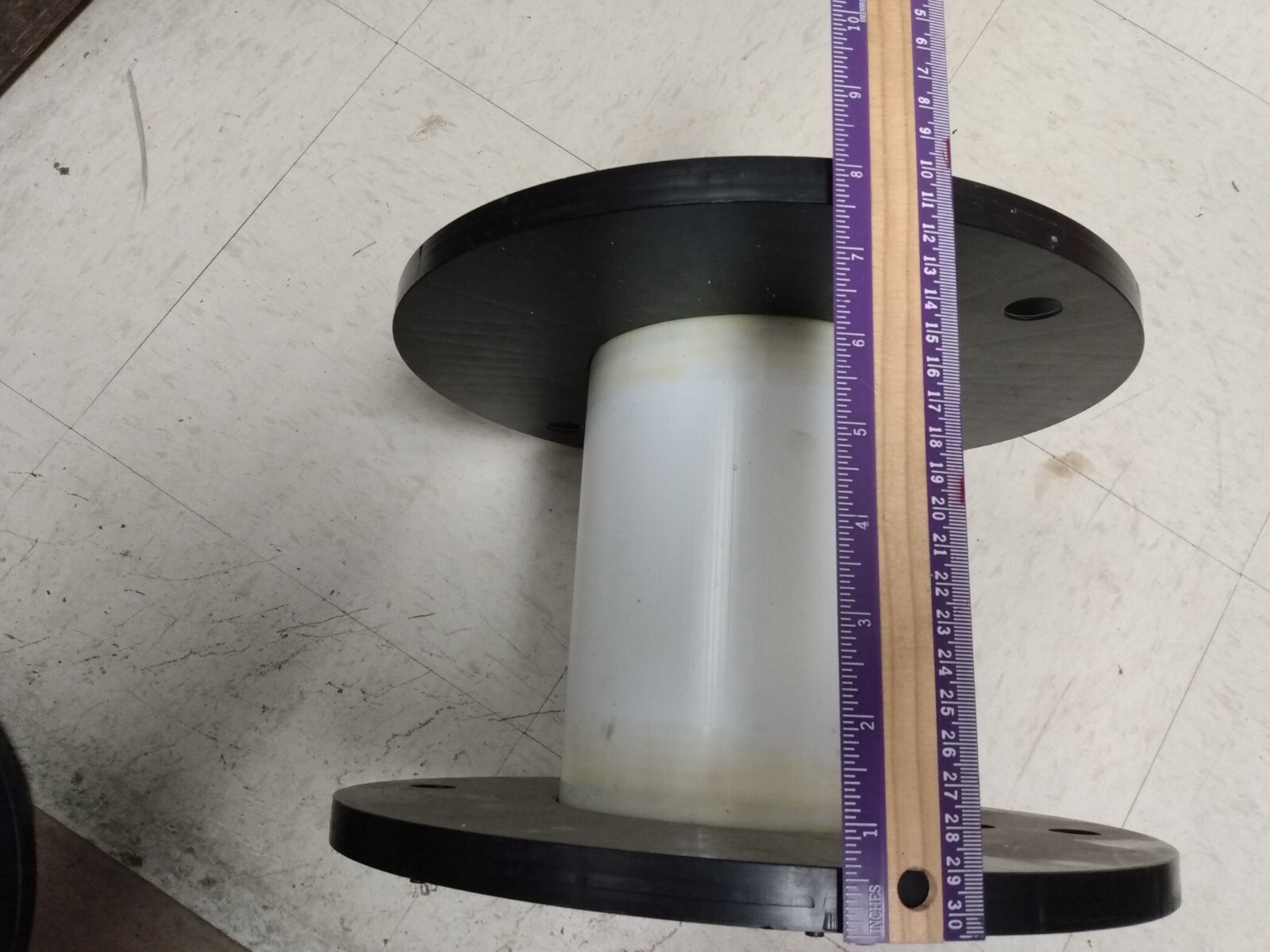Individual Plastic Spools for storing electrical cords and christmas lights.