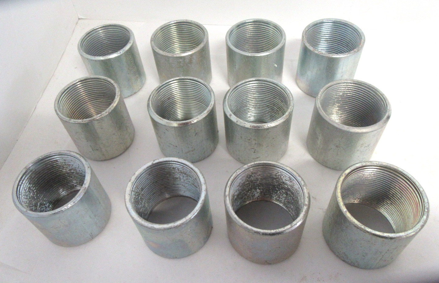 Lot of 12 New Old Stock 1-1/2″ Full Threaded Steel Couplings Ridgid Conduit IMC